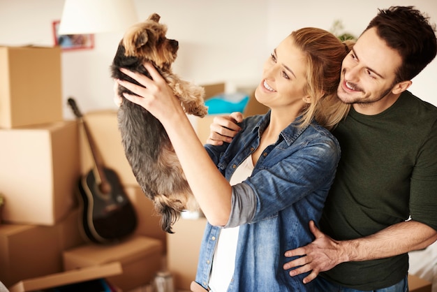 Portrait of couple with small pet