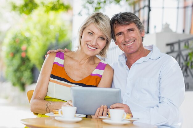 Portrait of couple with tablet pc