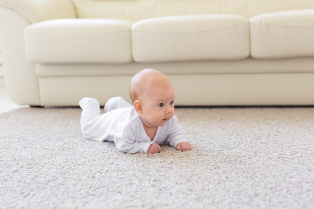 Portrait of a crawling baby on the floor