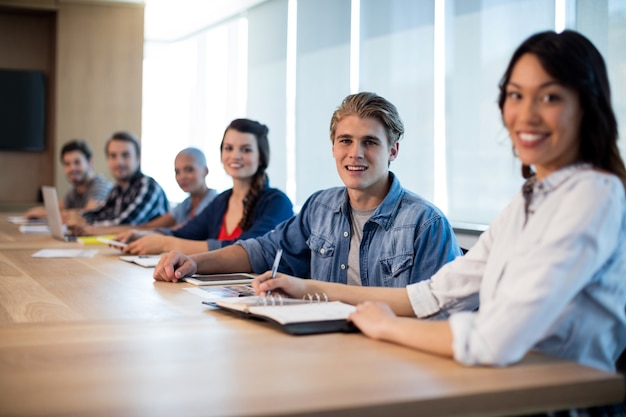 Portrait creative business team in meeting room at office