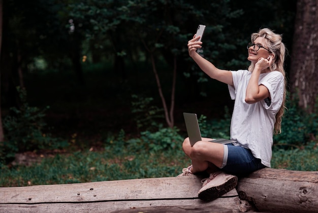 Portrait of a creative young smiling woman. work on laptop, lovely girl.