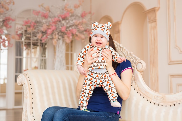 Portrait of crying baby boy in the room