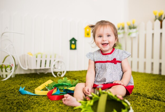 Portrait of curious little barefoot girl in dress