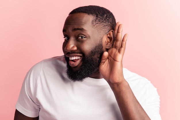 Portrait of curious man palm ear eavesdrop