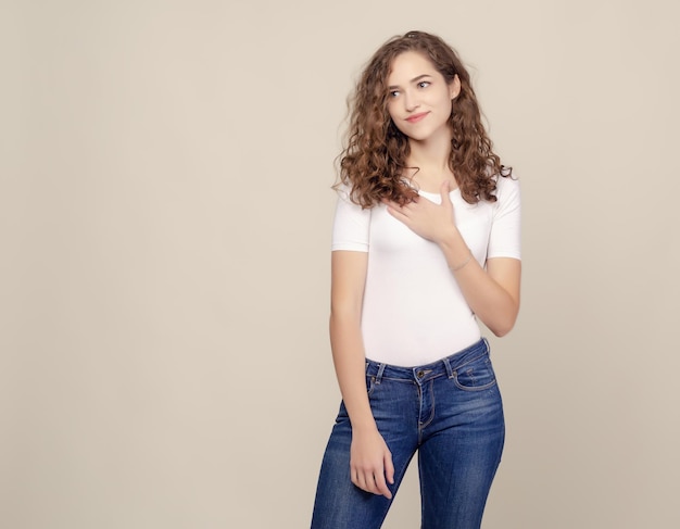 Portrait curlyhaired girl in white Tshirt and jeans