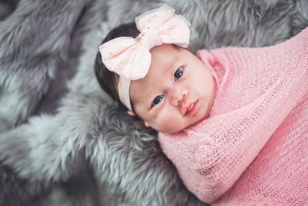 Portrait of cute baby on the bed