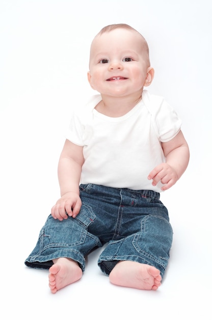 Portrait of cute baby boy against white background