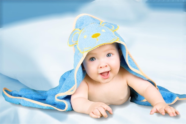 Portrait of cute baby boy on light background