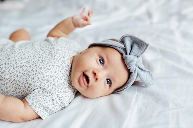 Portrait of cute baby boy sleeping on bed at home