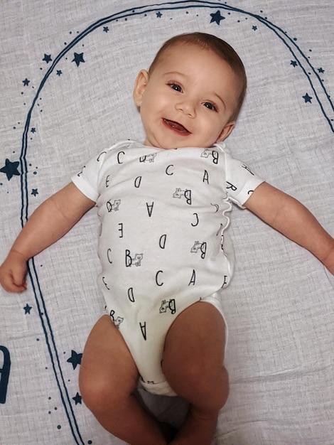 Photo portrait of cute baby boy smiling