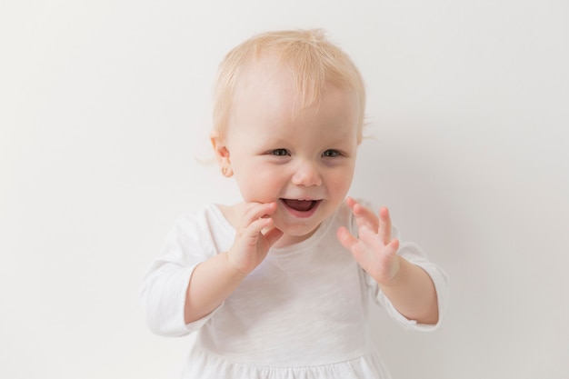 Photo portrait of cute baby girl laughing