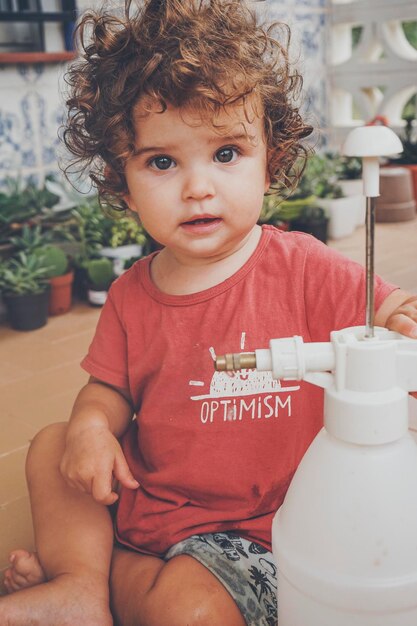 Photo portrait of cute baby girl sitting