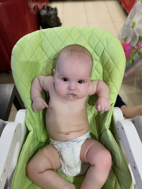 Portrait of cute baby girl sitting