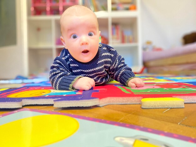 Portrait of cute baby at home