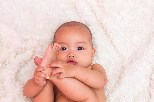 Photo portrait of cute baby lying down