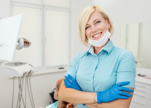 Portrait of cute blonde dentist in