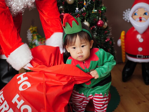 Portrait of cute boy in christmas tree