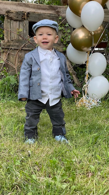 Portrait of cute boy on field