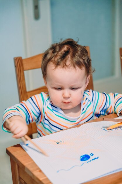 Photo portrait of cute boy at home