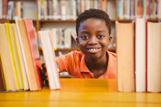 Portrait of cute boy in library