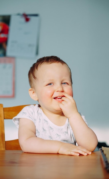 portrait of cute boy looking away on table