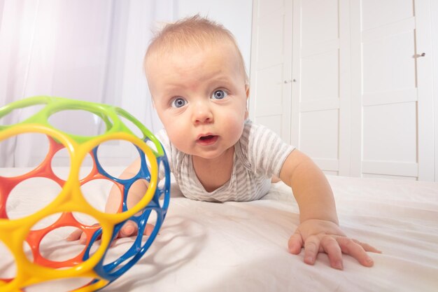 Portrait of cute boy playing with teddy bear