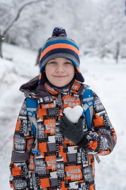 Portrait of a cute boy in the winter time