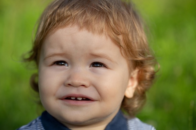 Portrait of a cute child baby boy Close up caucasian kids face Closeup head of funny kid