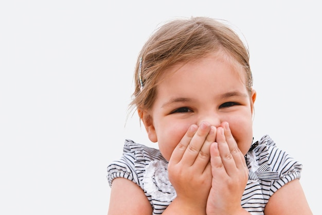 Photo portrait of cute girl against white background