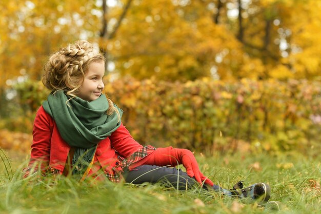 Portrait of a cute girl in the autumn park