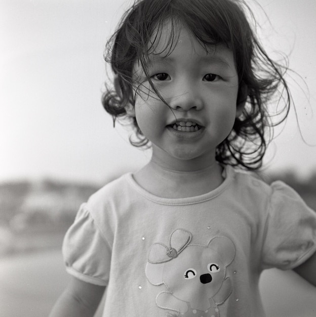 Portrait of cute girl on field against sky