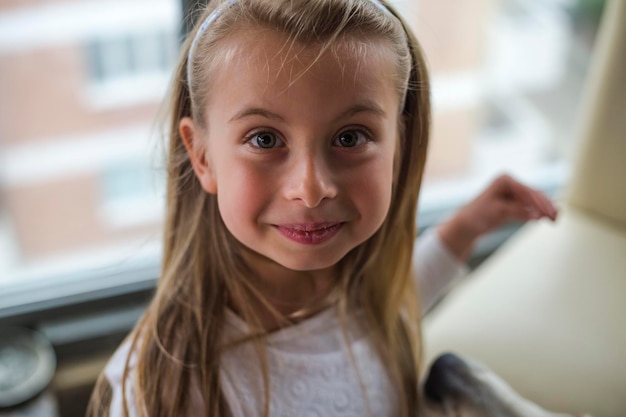 Portrait of cute girl at home