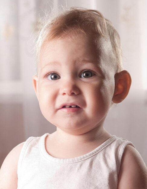 Photo portrait of cute girl at home