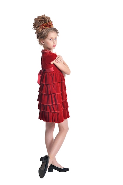 Portrait of cute girl in red dress posing isolated