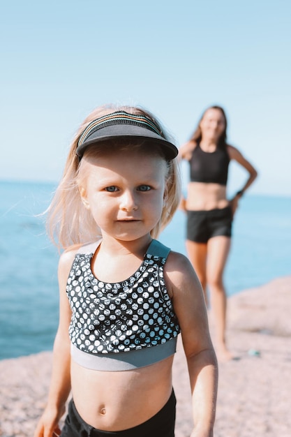 Portrait of cute girl standing at beach