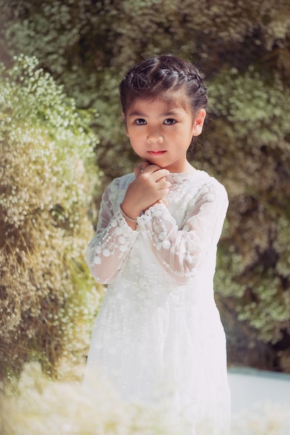 Portrait of cute girl standing outdoors