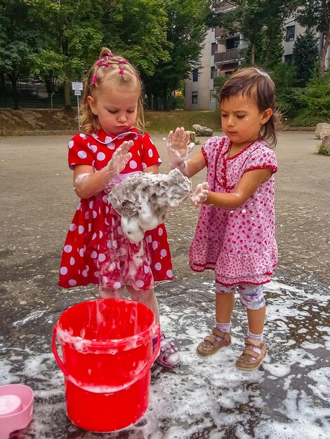 Portrait of cute girl with red water