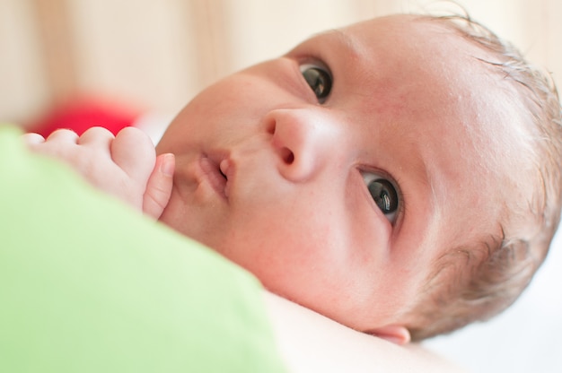 Portrait of cute little baby smiling peacefully