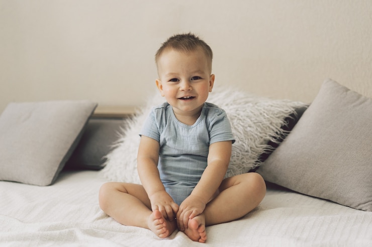 Photo portrait of a cute little boy in a bedroom