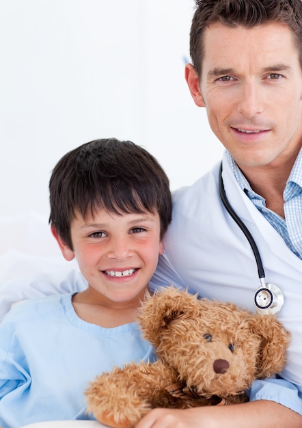 Portrait of a cute little boy and his doctor