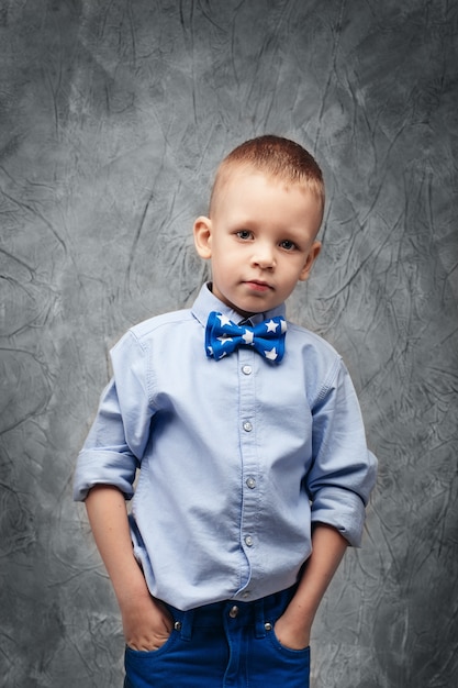 Portrait of a cute little boy in jeans