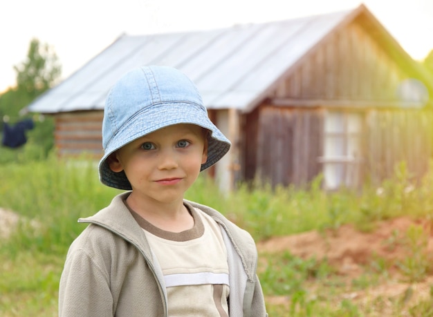 Portrait of cute little boy in village