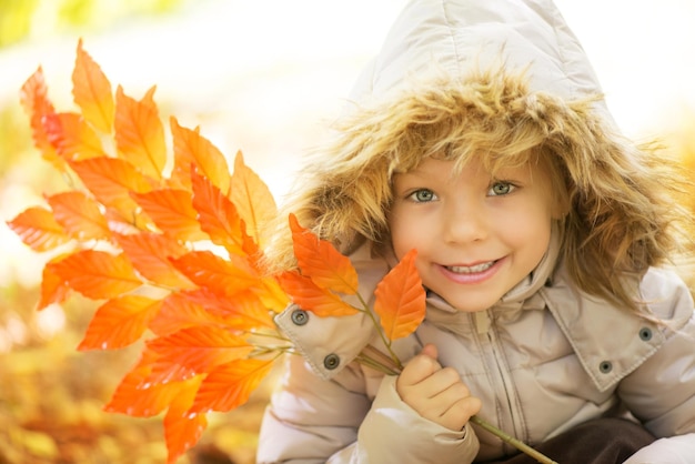 Portrait of cute little girl on beautiful autumn day.