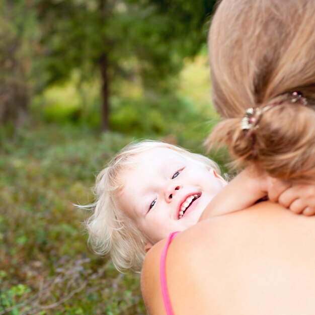 Portrait of cute little girl enjoying a summer day with her mom