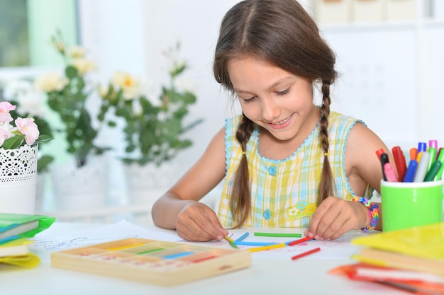 Portrait of a cute little girl learning