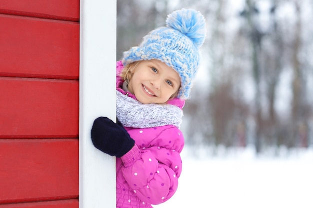 Portrait of cute little girl outdoors on winter day