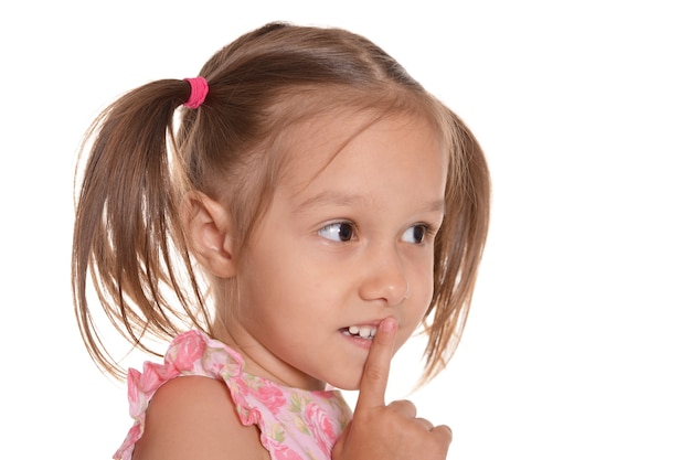 Portrait of a cute little girl in a pink dress