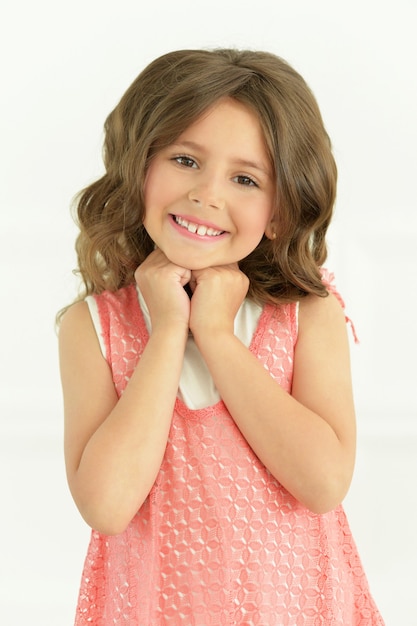 Portrait of cute little girl posing in beautiful dress