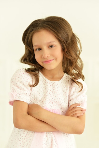 Portrait of cute little girl posing in beautiful dress