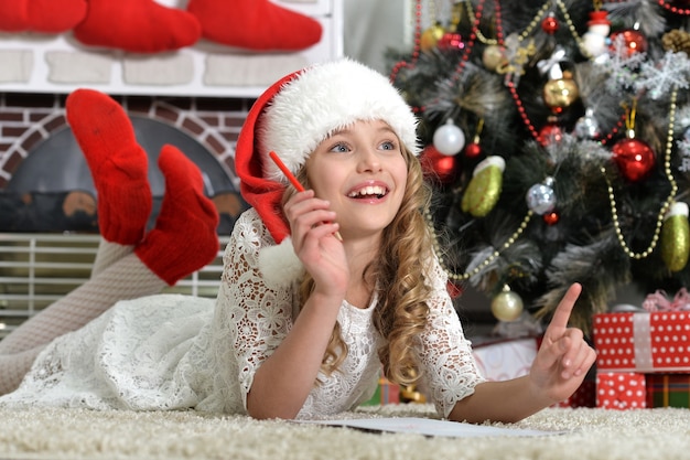 Portrait of cute little girl preparing to Christmas